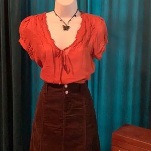 American Rag puff sleeve burnt orange top.